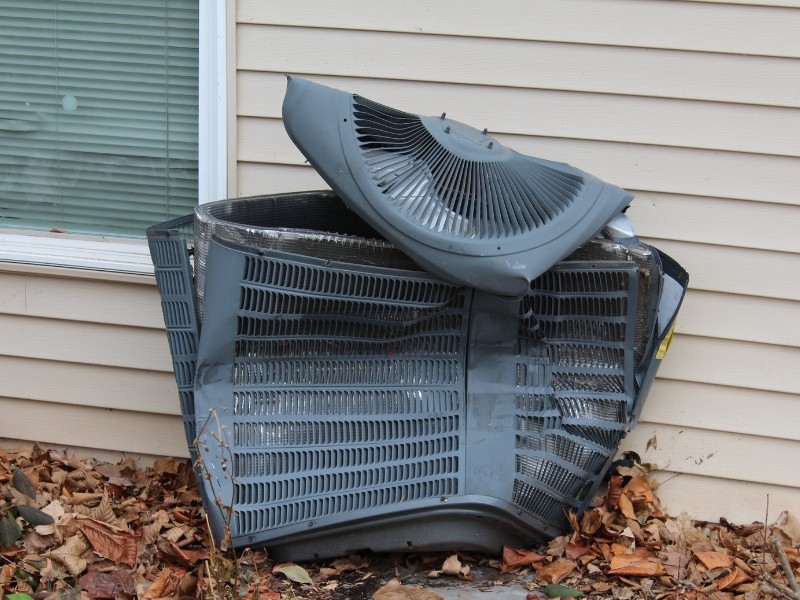 AC unit that has been smashed to pieces